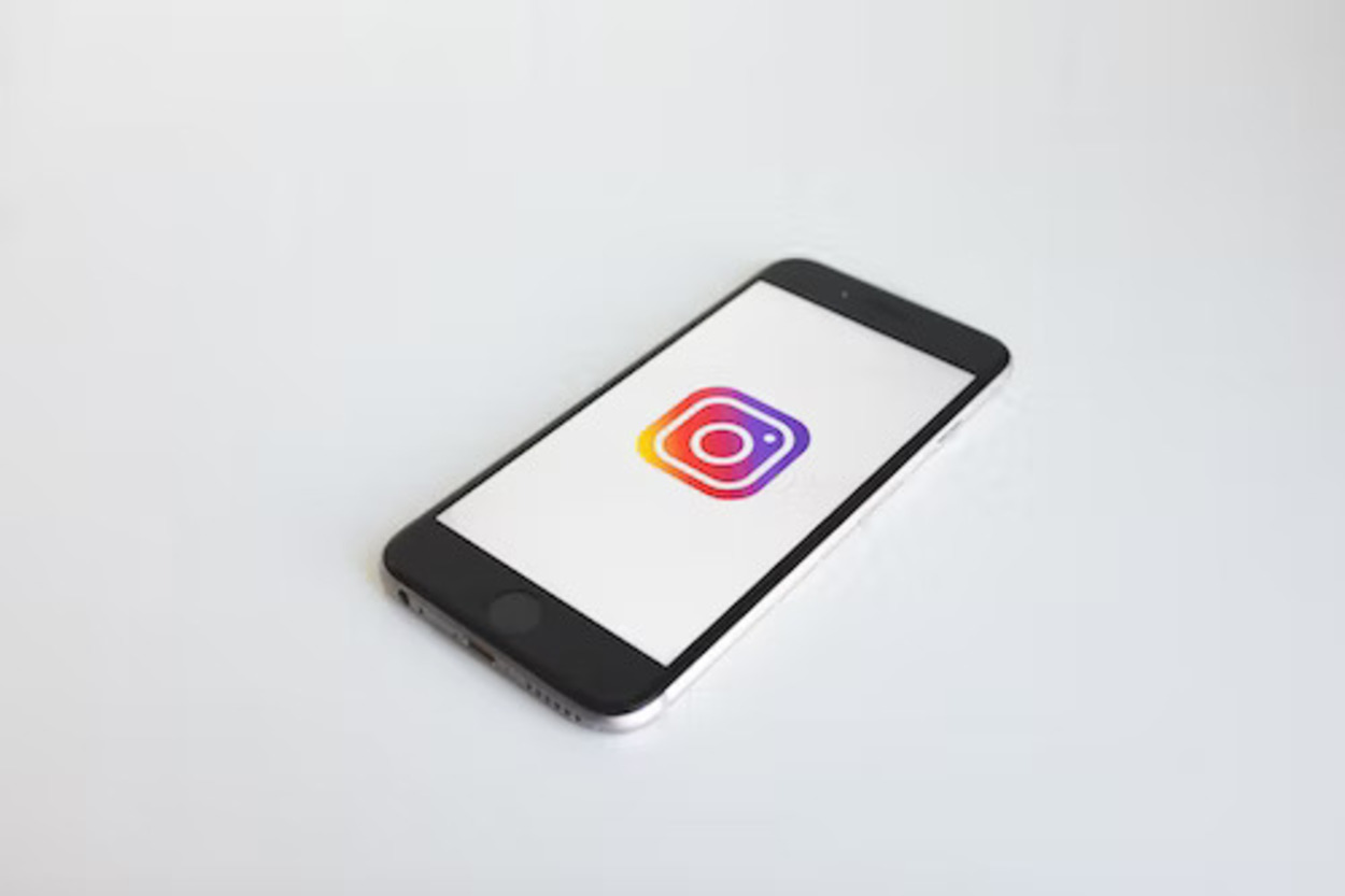 The Instagram logo appearing on a smartphone