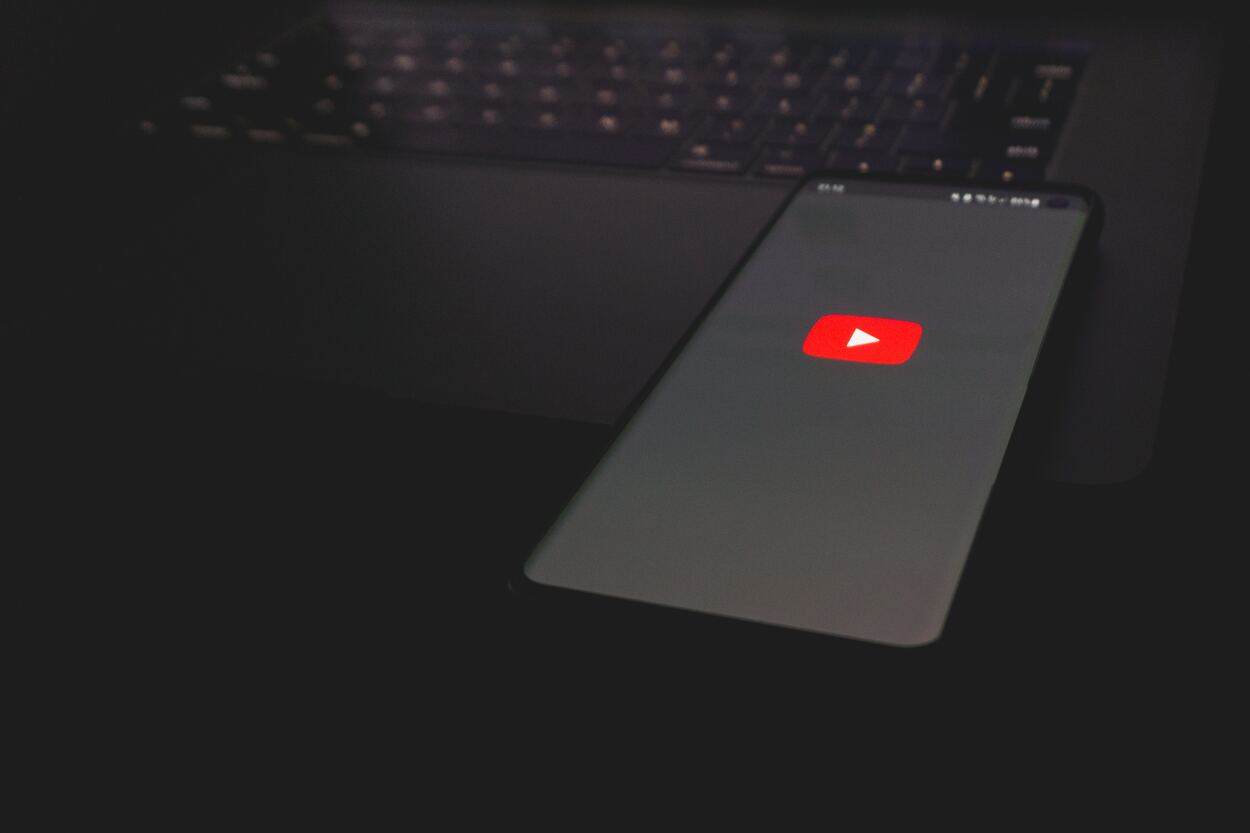 Black android phone with Dark Youtube Logo.