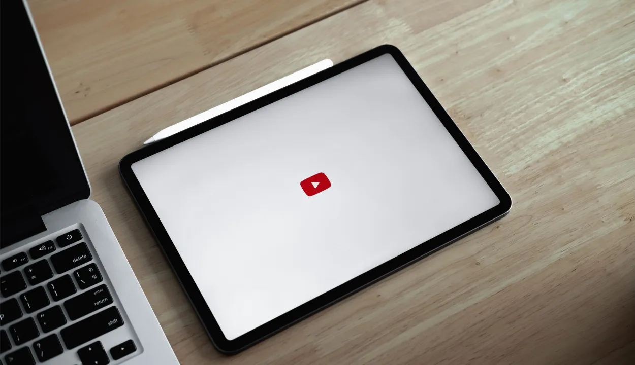An iPad with the YouTube logo on the screen