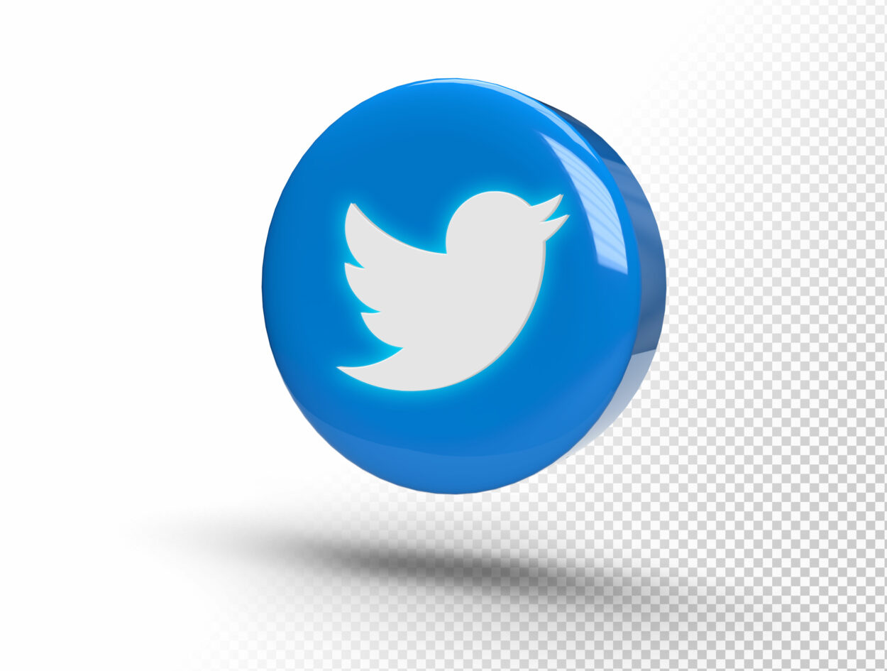 Glowing Twitter logo on a realistic 3D circle.