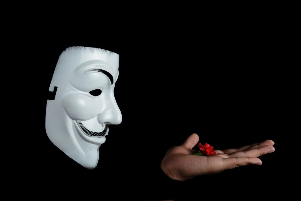 Anonymous holding a flower