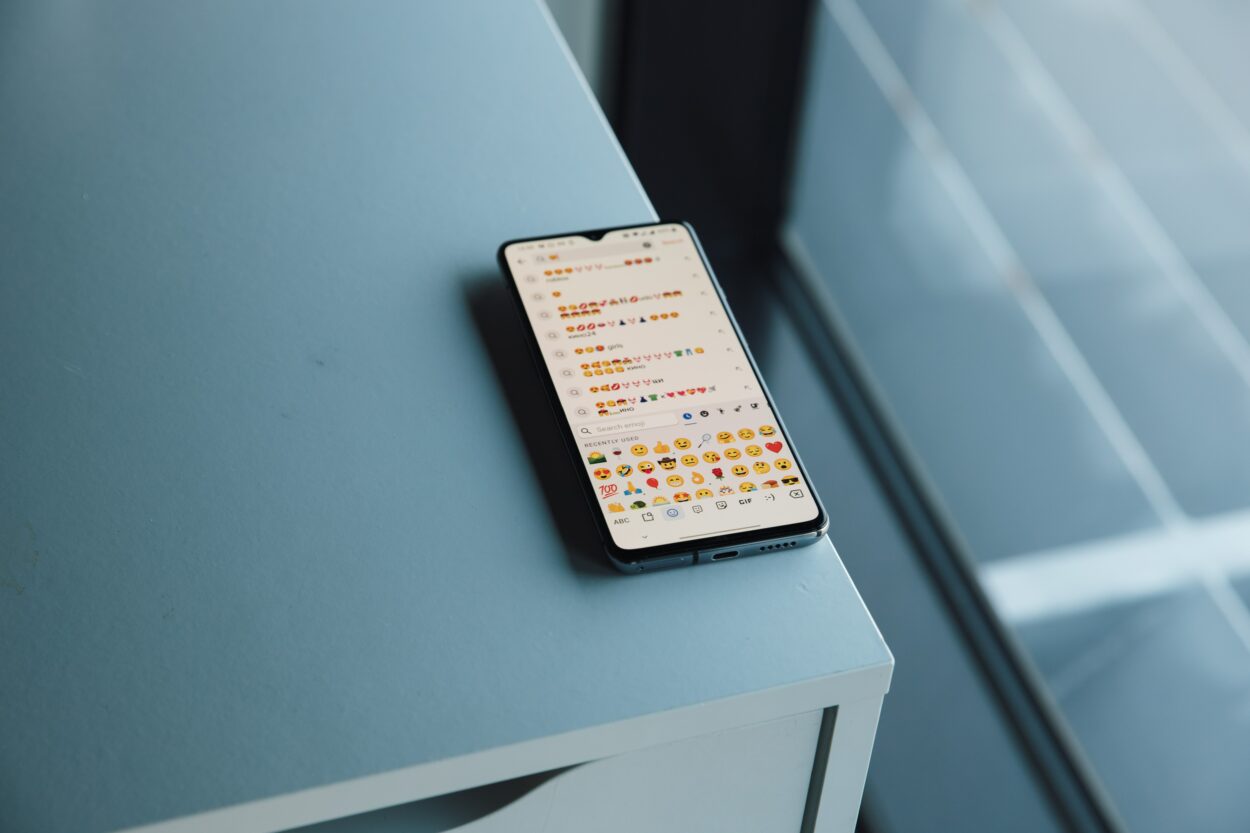 Texting with an emoji keyboard on a phone
