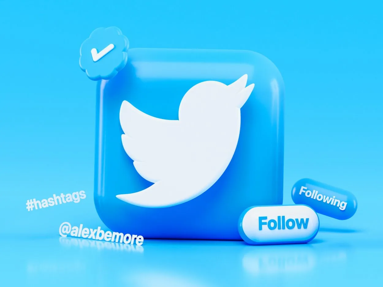 A 3D Twitter logo surrounded by icons of its famous features like hashtags, verified tick, etc.